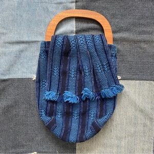 woven blue fringe handbag wooden handle